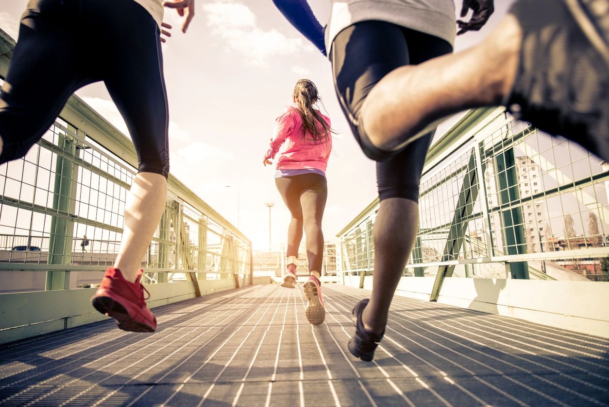 Three People Running in the City